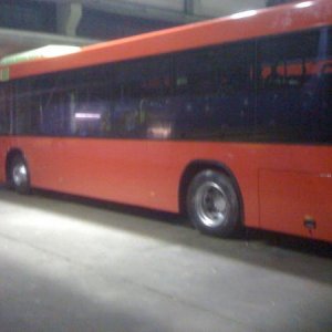 White Bus with Red Wrap