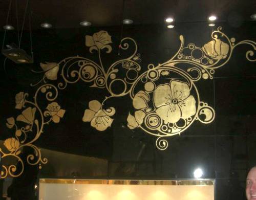 Decorative gilding on a jewellers shop interior wall