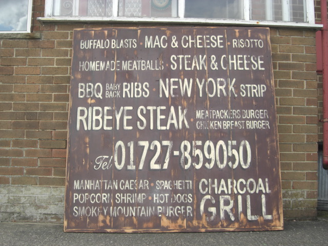 distressed wooden sign