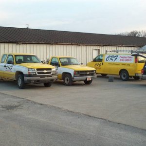 Vehicles lettered for a property rental company