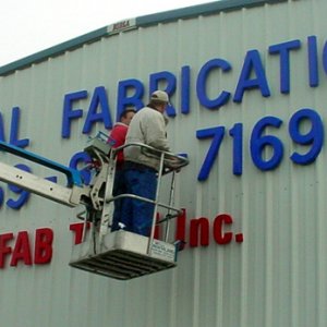 Gemini letters installed on wall