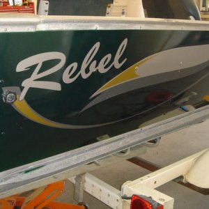 New striping and graphics on a repainted Lund Rebel fishing boat