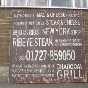 distressed wooden sign