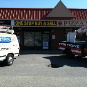 Buy & Sell with the window wrap, new backlit sign face (2'x16') with two of my trucks.