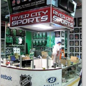 We fabricated a custom sales counter to look like rink boards c/w plexi tops and created a faux score clock to hang above.

Visit www.xtremesign.ca