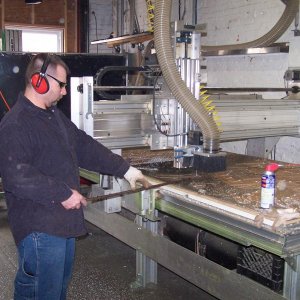 Routing out letters for our sign on our CNC table.