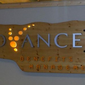 Routed pine lobby sign with backlit Acrylic. Letters are PVC