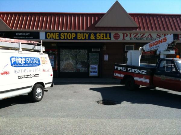 Buy & Sell with the window wrap, new backlit sign face (2'x16') with two of my trucks.