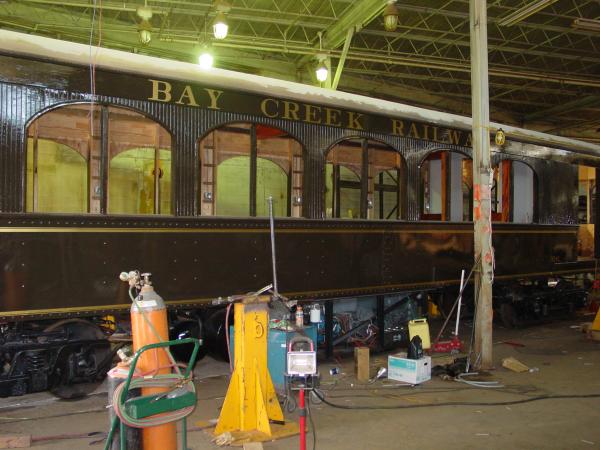 Lettering and striping on restored railcar