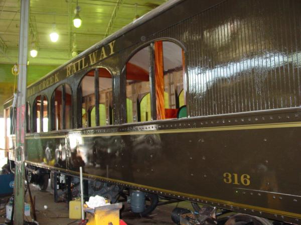 Lettering and striping on restored railcar