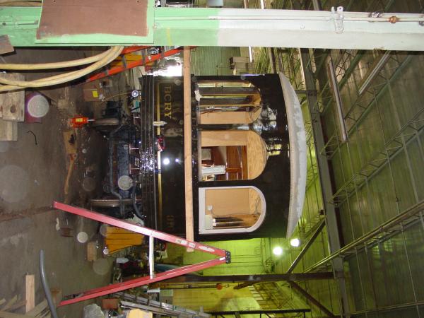 Lettering and striping on restored railcar