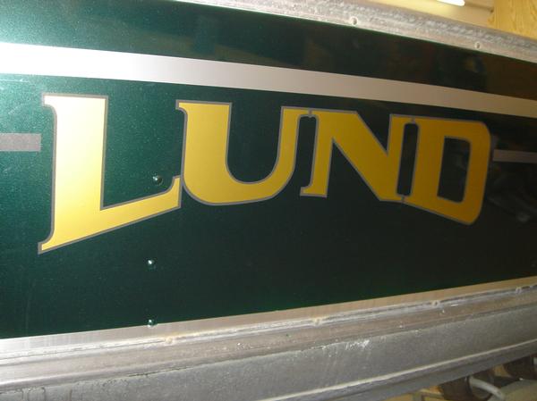 New striping and graphics on a repainted Lund Rebel fishing boat