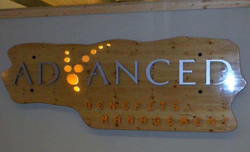 Routed pine lobby sign with backlit Acrylic. Letters are PVC
