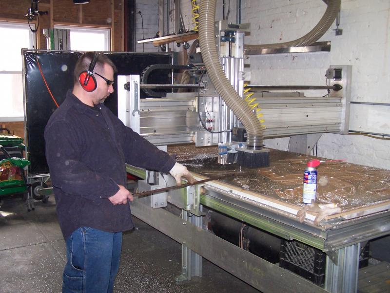 Routing out letters for our sign on our CNC table.