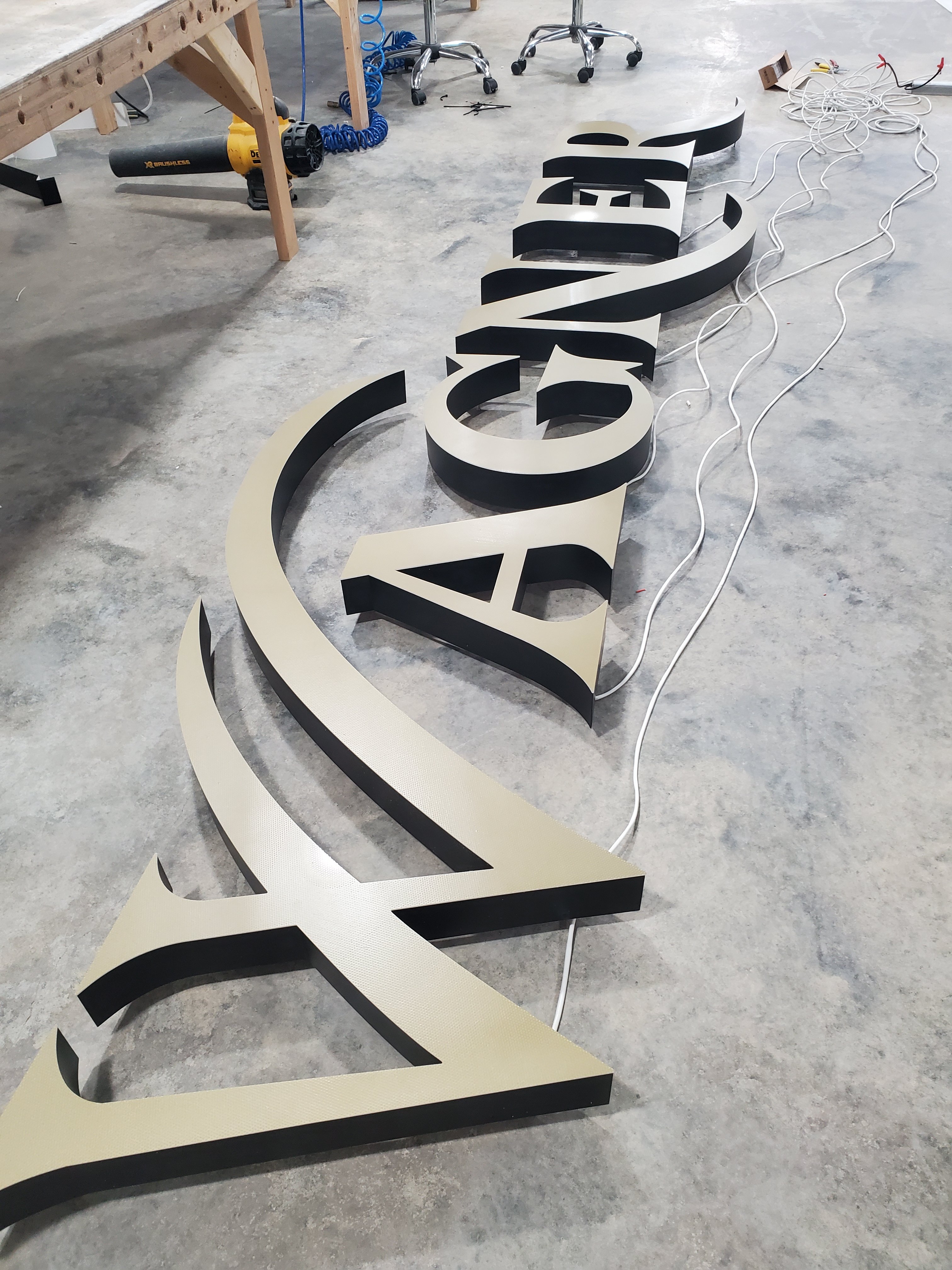 trimless edge channel letters with painted gold perf vinyl