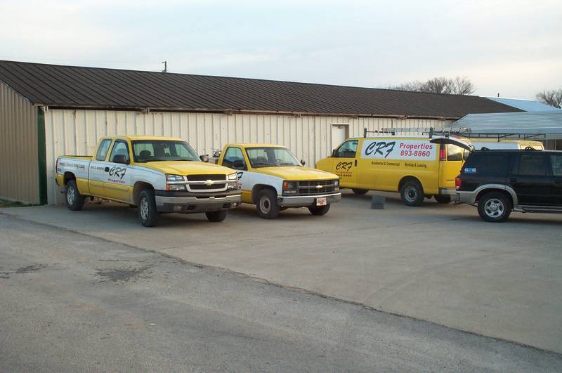 Vehicles lettered for a property rental company