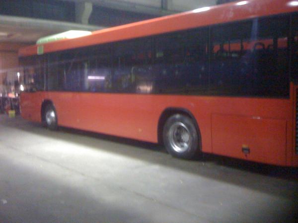 White Bus with Red Wrap